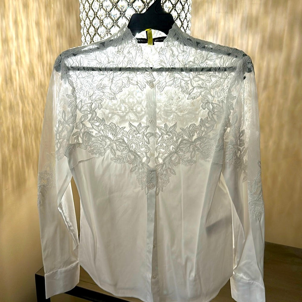 White long sleeve lace button down blouse beautiful for every occasion.